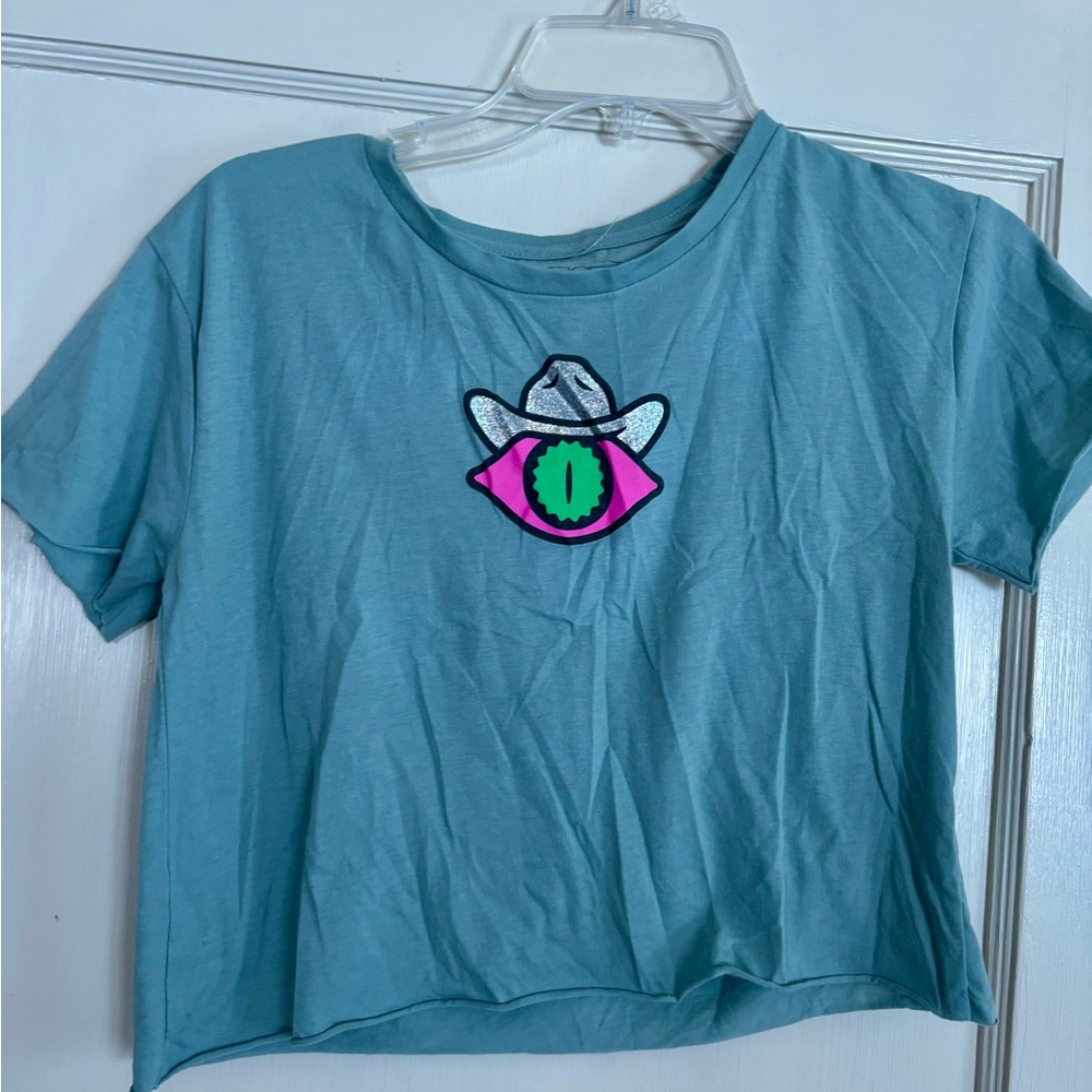 Meow Wolf Teal Graphic Cropped Tee with Neon Eye Patch